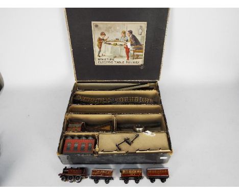 Bing - A Miniature 1920s 00 gauge Electric Table Railway set number # 2. Contains a 2-4-0 loco, 2 x coaches, a baggage car, 2