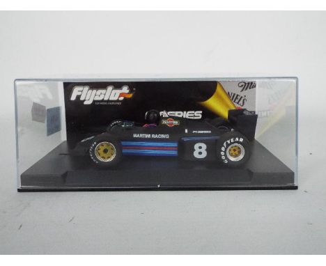 Flyslot - a 1:32 scale racing slot car. Item is a F1 series Williams FW08C Martini edition with the code 40301. Item appears 