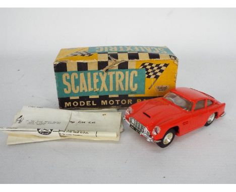 Scalextric - A Tri-ang Boxed E3 Aston Martin DB4 racing car with light feature. Box appears to be in poor to fair condition W