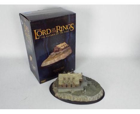 Sideshow Weta - A boxed limited edition Lord Of the Rings Golden Hall resin model. It has a small area of damage on the roof.
