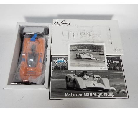 GMP - A boxed 1:18 scale Dan Gurney McLaren M8B High Wing # 12023, model appears M in NM original box and outer card box. (Th