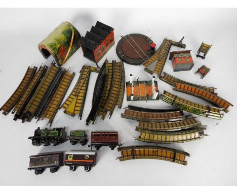 Bing - An unboxed OO gauge Clockwork 2-4-0 steam locomotive and tender (with a key) Op.No.504 in green LNER livery, with thre