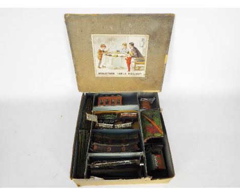 Bing - A boxed OO gauge Electric Table Railway from Bing. The set comprises of a 2-4-0 steam locomotive in GWR green livery, 