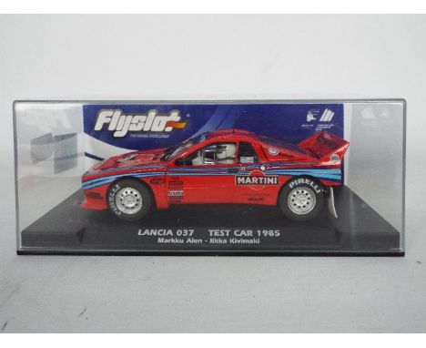 Flyslot - A 1:32 scale racing slot car. Item is a Lancia 037 test car 1985 &amp; is coded with 046103. Item appears to be min