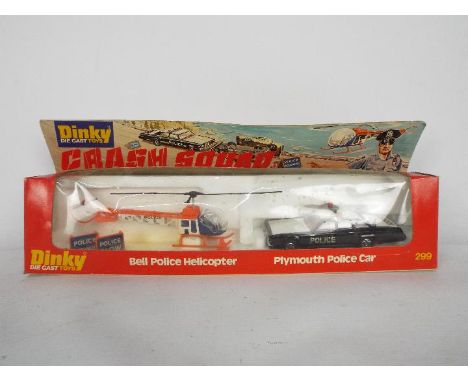 Dinky Toys - A boxed Dinky Toys #299 Police Crash Squad. The two piece set includes Plymouth Police Car in black and white, r