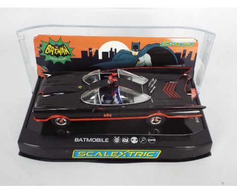 Scalextric - A boxed 1966 TV series Batmobile # C4175. The model shows light signs of use to its brushes, it appears otherwis