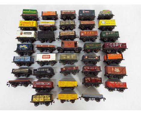 Peco, Other - A collection of over 30 unboxed OO gauge freight rolling stock wagons and vans, many of which appear kit built.