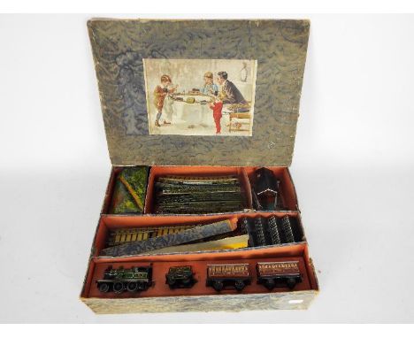 Bing - A Miniature 1920s 00 gauge Table Railway set. Contains a clockwork 2-4-0 loco with key, 2 x coaches, 34 x track sectio