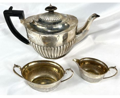 A near matching monogrammed oval Georgian style 3 piece tea set with fluted lower sections, teapot Liverpool 1889, milk and s