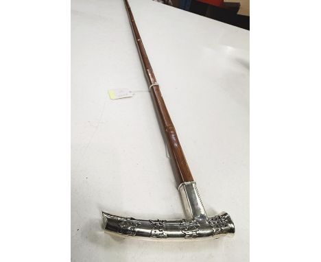 A Chinese square section cane, circa 1900, with silver handle, 91cm.Good overall condition.WE TAKE GREAT CARE in the accuracy