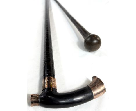 A vintage horn walking stick with sectional shaft and gilt metal mounts, 102cm, and a similar stick.