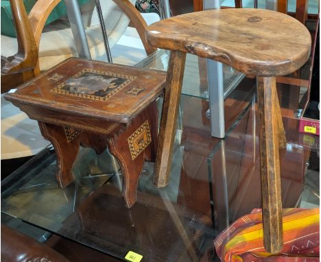 A stool in the manner of :- Richard 'Mouseman' Thompson, a three legged kidney-shaped stool, height 46cm, with carved mouse t