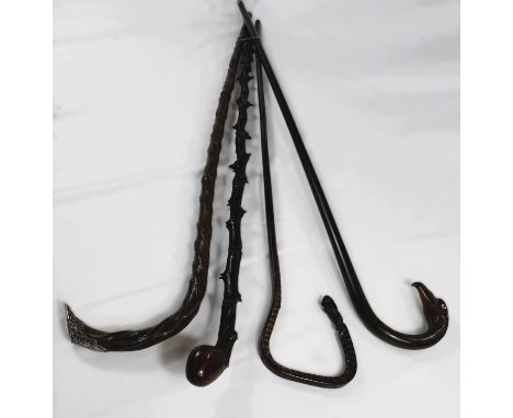 A 19th Century blackthorn stick, 91cm, another with twist pattern stem and silver finial, and two other sticks (4).