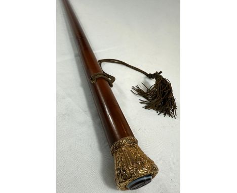 An early 19th Century Malacca cane walking stick stamped 'Margadle' having embossed gilt metal crown shaped finial set in eng