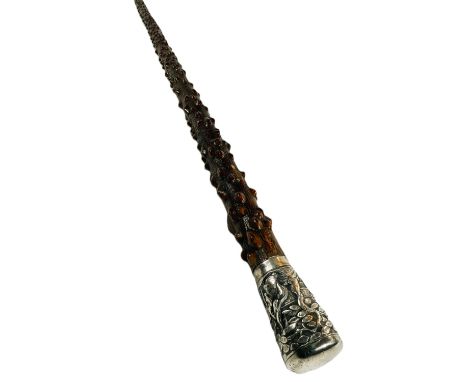 A Chinese walking stick, the shaft with knobbly bark finish and having silver finial decorated in relief with Go players, 87c