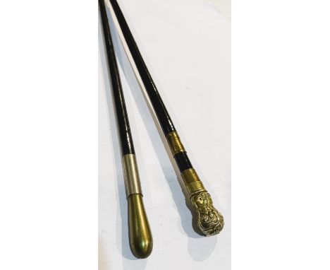 A 19th Century sword stick with ebonised shaft and moulded finial, 90cm, blade length 66cm, and another stick (2).