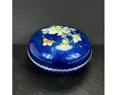 A Chinese white metal cloisonne enamel lidded pot with butterfly decoration.