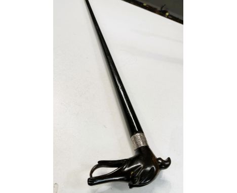 A 19th Century ebonised walking stick with carved horn head of a greyhound, 93cm.
