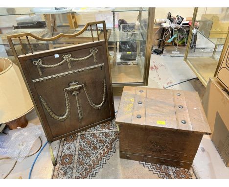 A brass fire screen and a copper coal box.