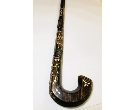 An Indian hardwood ceremonial stick with inset mother of pearl decoration, 92cm.