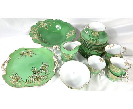 A NORITAKE green enamelled porcelain tea service, a selection of blue and white and other meat platters; a large Imari patter