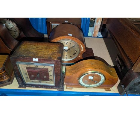 A chiming mantle clock in inlaid mahogany case; 2 1930's oak striking mantle clocks and a 1930's mantle clock.