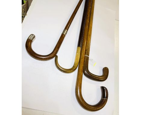 An early 20th Century hardwood stick in the form of a pool cue, 87cm, and three others of the same vintage (4).