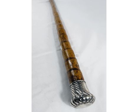 An Edwardian heavy cane walking stick with silver gadrooned finial, London, 1910, 94cm.
