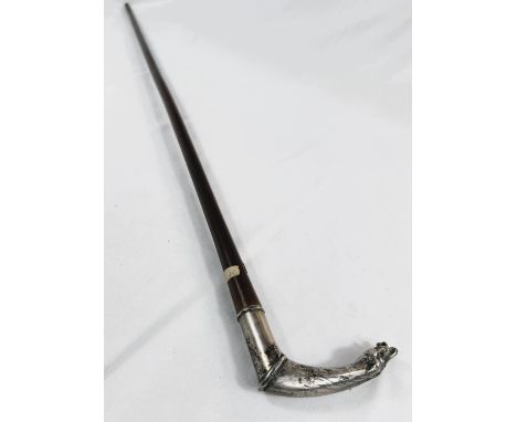 A French 19th Century lady's riding stick with double horse head silver handle, 83cm.