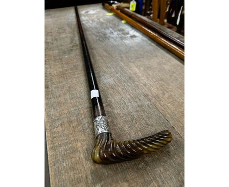 A 19th Century ebonised walking stick with spiral twist carved horn handle, 91cm.