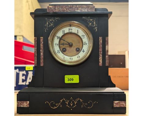 A black marble mantel clock with granite detail.