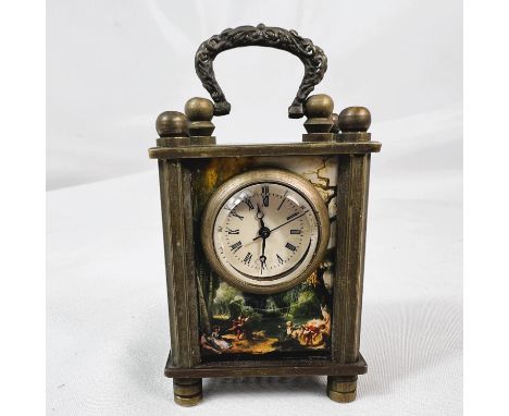 A miniature carriage clock with classical style reproduction panels, height 5.5cm.