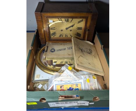 A 1930's oak striking mantel clock; a mirror; humorous postcards; book on Topolski, etc.