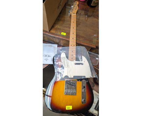 A Fender Telecaster Mexican electric guitar made with original scratch plate.
