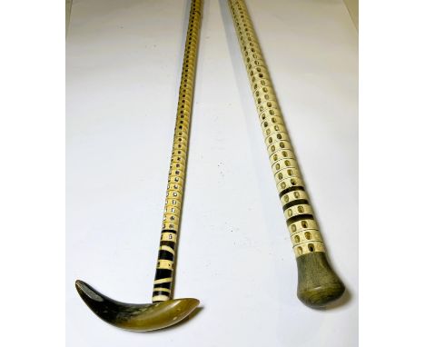 A 19th Century fish vertebra walking stick with horn finial, 92cm, and another similar (2).