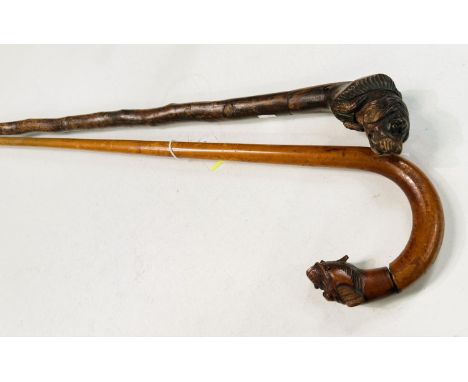 A vintage walking stick with carved dog's head finial, 93cm, and another (2).
