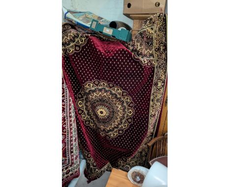 A 20th Century Turkish made maroon ground carpet.