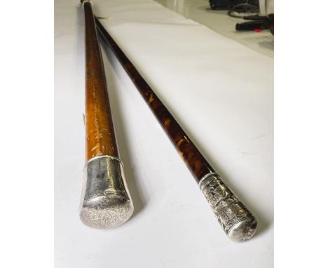 A 19th Century Malacca cane with white metal mount, 75cm and a Chinese tortoiseshell stick with silver finial 95cm (2).