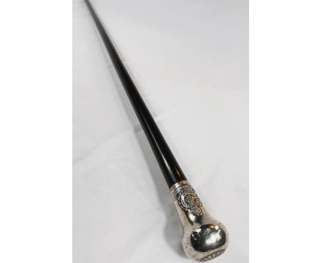 An early 20th Century presentation stick with ebony shaft, the silver knop bearing the badge of the Lancashire Fusiliers and 