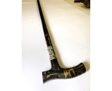 A 19th Century walking stick with tortoiseshell covered shaft and similar handle, 89cm.