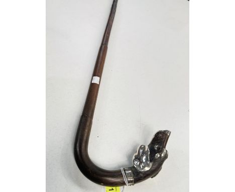 A 19th Century walking stick with loop handle having carved and silver-mounted dog's head finial, 91cm.