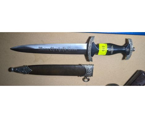 A WWII style German SS knife with scabbard and fittings.