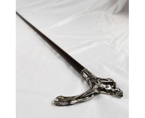 A continental Art Nouveau walking stick with hardwood shaft and white metal handle in the form of a reclining female, 90cm.