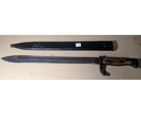 A German WWI period bayonet in scabbard Waffenfabrik to blade.
