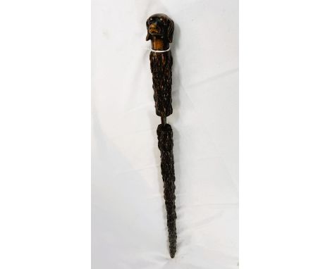 A 19th Century sword stick with bark finish shaft and carved dog's head, 89cm, blade 41cm.