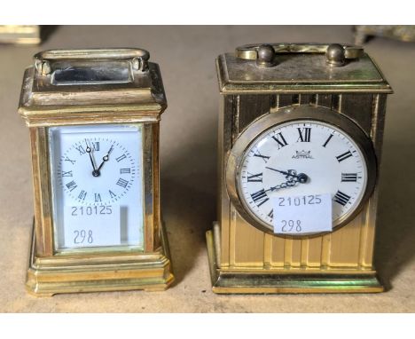 A small 19th century style brass carriage clock with time piece movement, height 7.5 cm; a small modern carriage clock.
