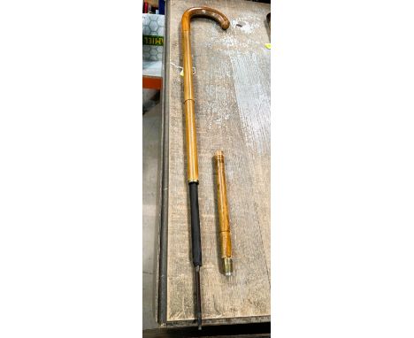 An early 20th Century turned wood walking stick concealing an umbrella, 91cm.