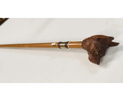 A 19th Century oak shaft walking stick with carved dog's head finial, 92cm.