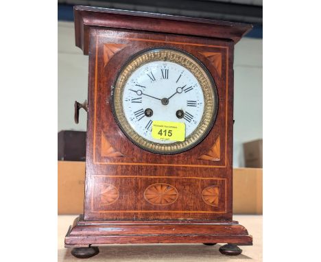 An Edwardian mantel clock with Sheraton revival mahogany case, French 8-day movement, 27cm.
