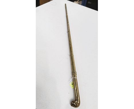 A 19th Century Indian brass sword stick with simulated cane shaft and lion's head finial, 90cm.
